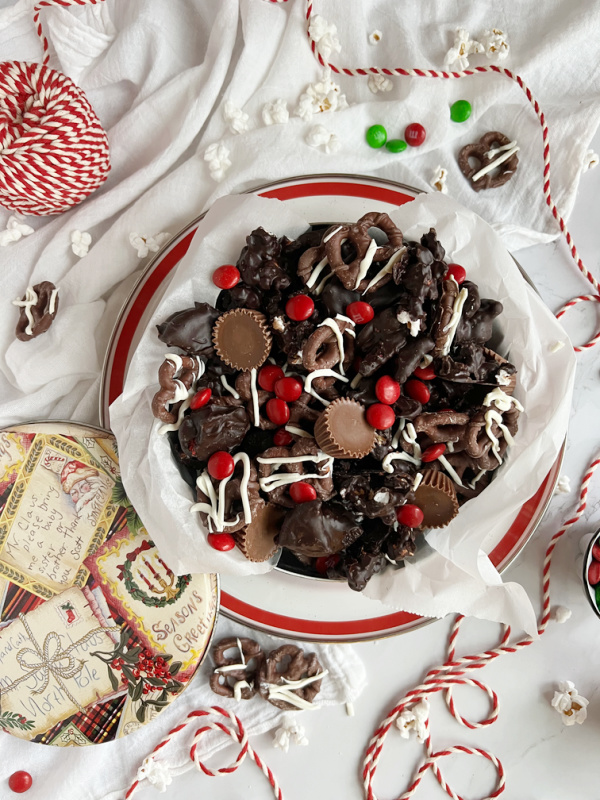 Jingle Jangle chocolate snack mix with chocolate covered popcorn, pretzels, peanut butter cups and red m & m candy. 