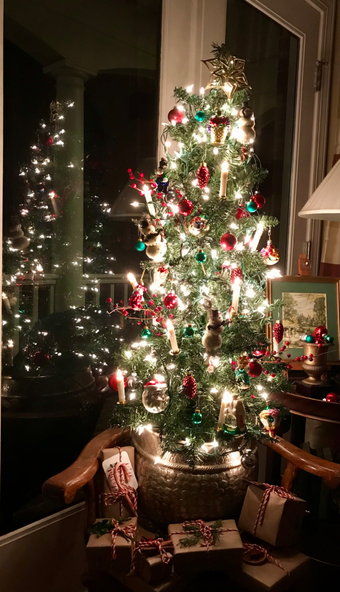 Mini christmas tree with lights and presents.