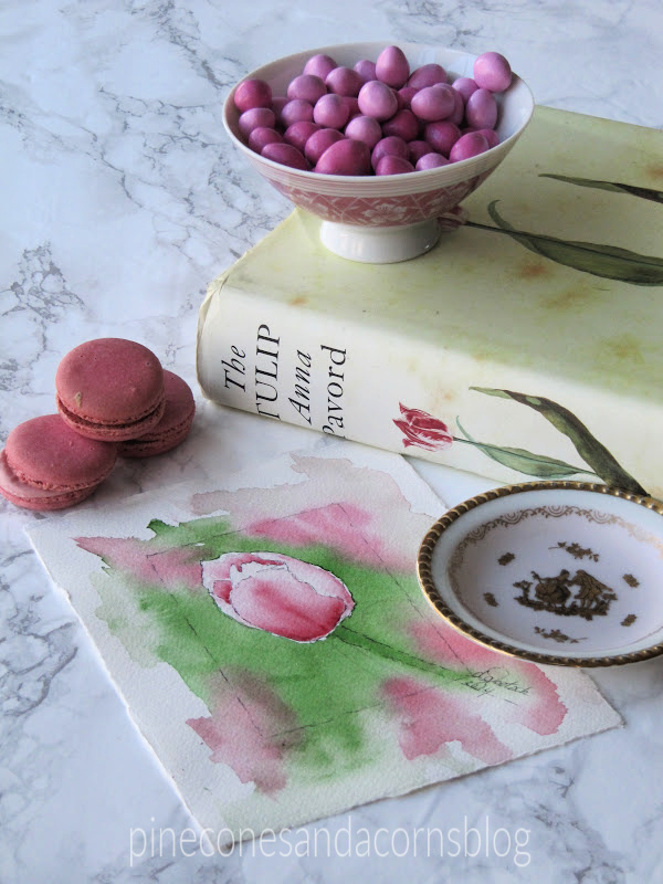 Spring-tulip-watercolor-pink-macaroons-a-tulip-books-and-a-bowl-of-pink-candy.