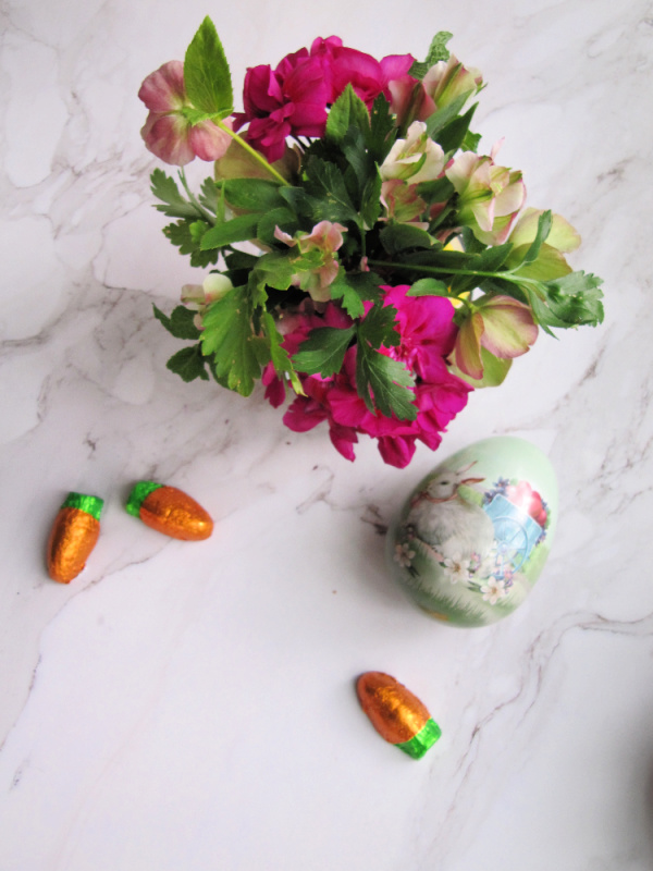 Spring Flowers, an easter egg and orange carrot candy