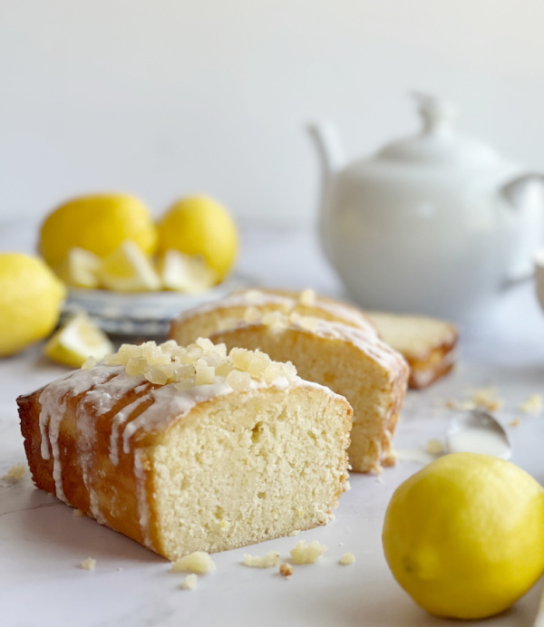 candied lemon pound cake with a white tea pot.