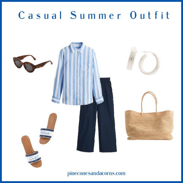 Blue and white summer outfit fashion over 50 with blue pants, blue and white linen shirt, wicker tote, beaded sandals that say chin Bella, and silver hoop earrings.
