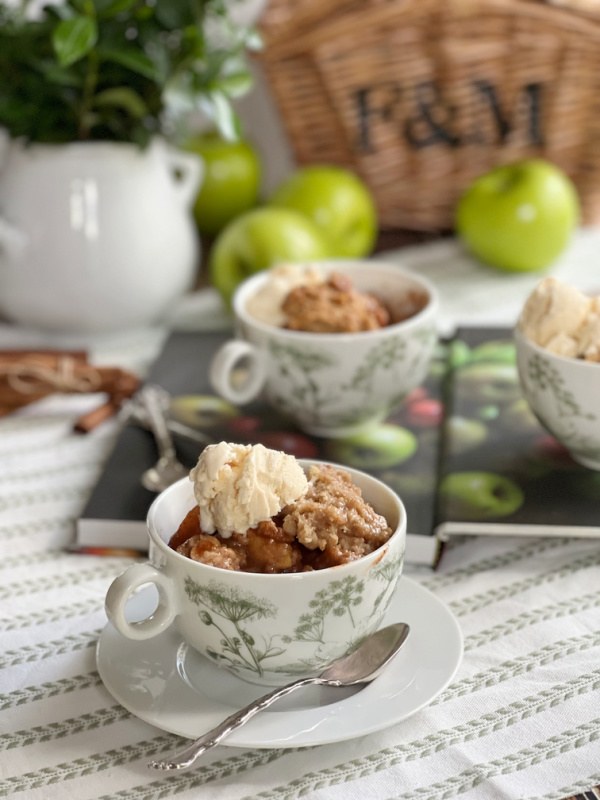 Ina garten apple crisp in a green and white mug. 