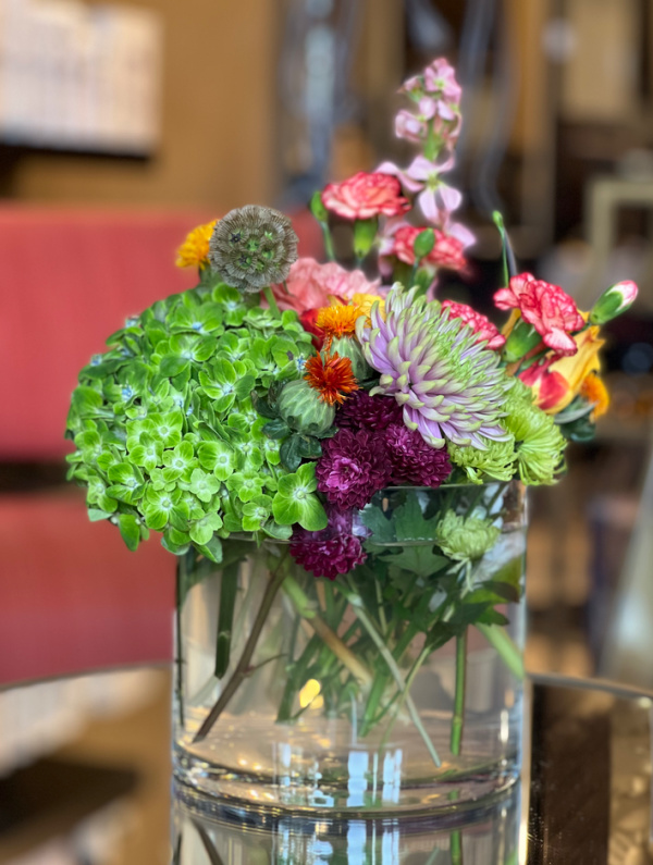 fall flowers in a clear glass vase