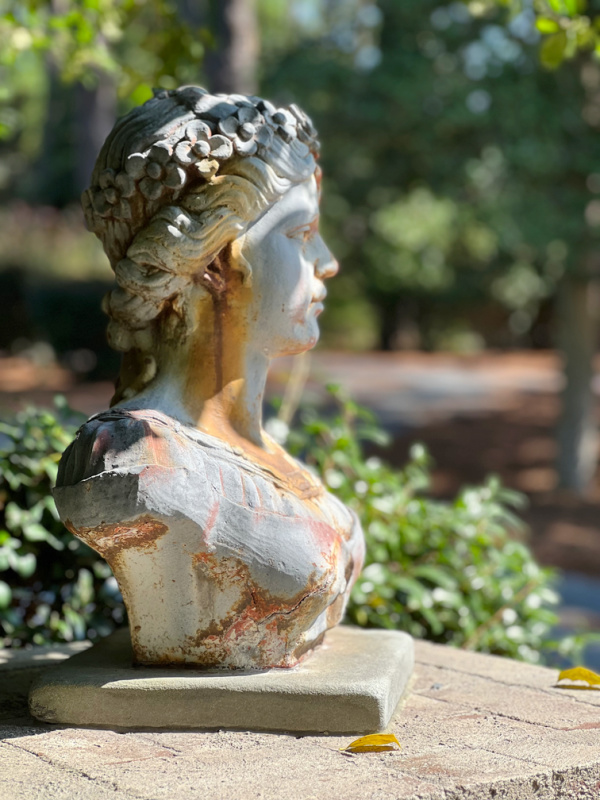 weathered statue of a woman.