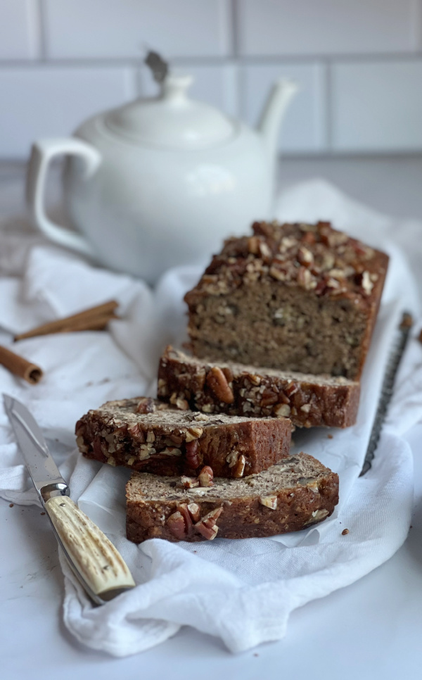Banana bread with a white tea pot.