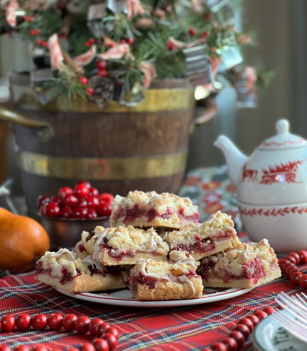 Cranberry Pear bar with crumble topping, a pot of tea and a teapot.