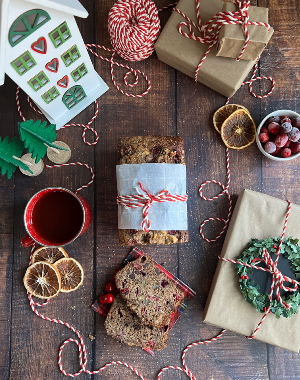 Cranberry apple Bread with sliced dried oranges and a red, green and White House.