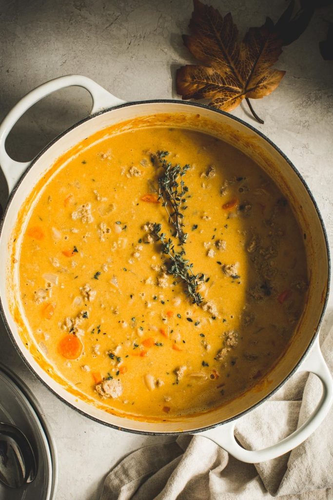 Turkey Pumpkin White Bean chili in an enamel pot. 