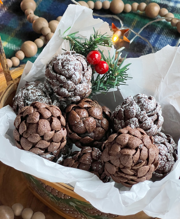 Basket of chocolate brownie pinecones made with chocolate cereal.