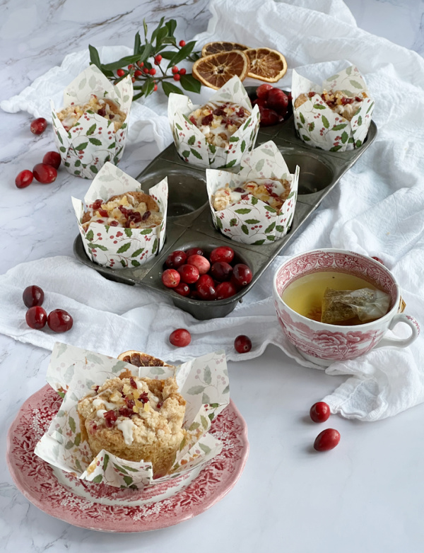 Cranberry Orange Muffins with Candied Orange Peel in festive wrapping.