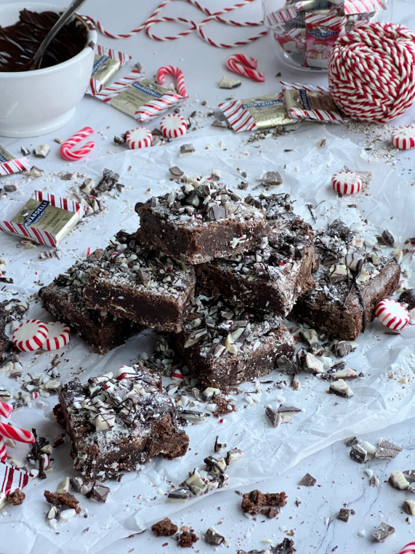 Peppermint Bark Brownies with scattered candy and chocolate.