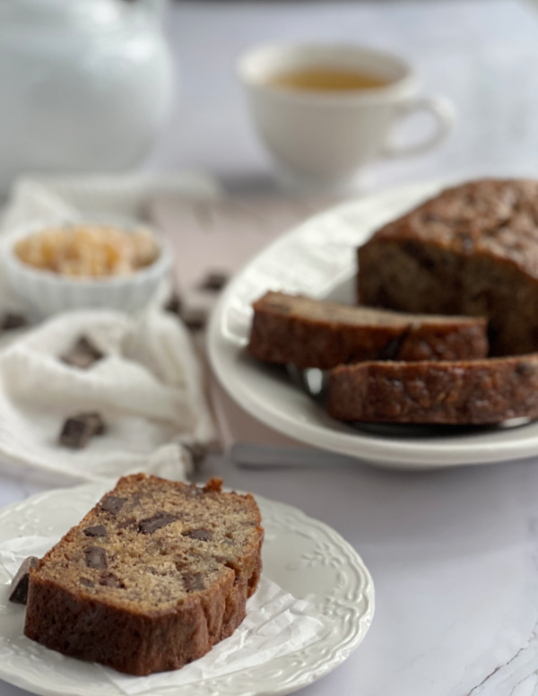 Crystallized Ginger Chocolate Banana Bread sliced on a plate.