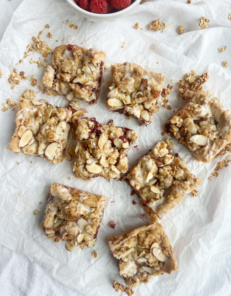 Ina Garten raspberry crumble bars and a bowl of raspberries